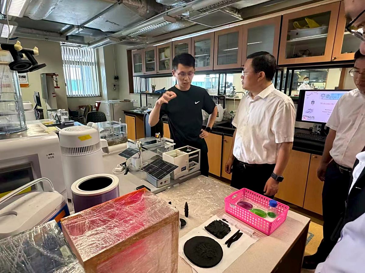 S Triformix leadership visiting a university research laboratory for technical collaboration